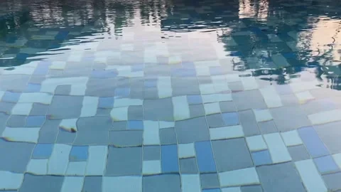 Shaking swimming pool water surface with rippling waves and dynamic reflections Stock-Footage 311504986
