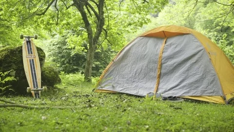 Shaking tent with fire in foreground at forest Stock-Footage 72505055