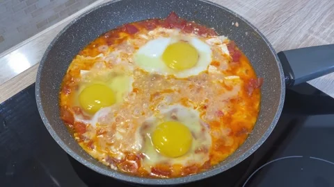 Shakshuka is being fried in a pan, breakfast Stock Footage 308113702