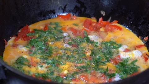 Shakshuka - middle eastern dish of eggs boiled in tomato sauce, pepper and onion Stock Footage 95240143