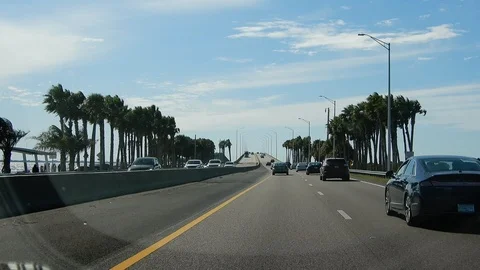 Shaky Camera Driving Over Bridge In Miami With Palm Trees On Either Side Stock Footage 127146589