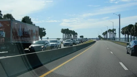 Shaky Camera Driving Over Bridge In Miami With Palm Trees On Either Side 002 Stock Footage 127146611