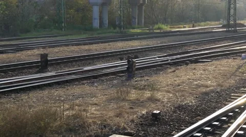 Shaky tracking shot from moving train on rails and reflecting sun Stock Footage 43196834