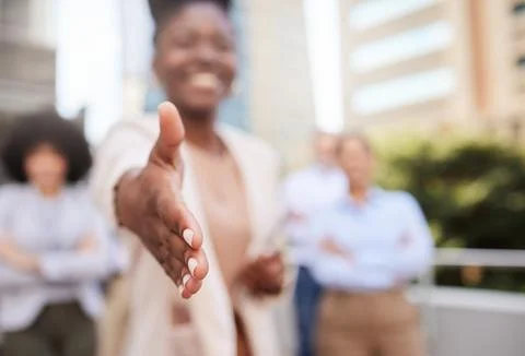 Shall we shake on it. an unrecognisable businesswoman standing with her hand Stock Photos