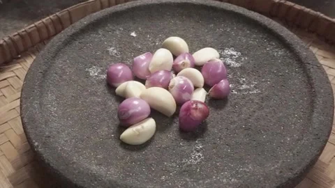 Shallots and garlic in the pounder Stock Footage 244932576