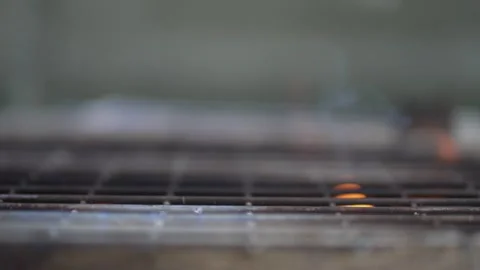 Shallow depth of field  BBQ grill with glowing embers Video stock 265081897