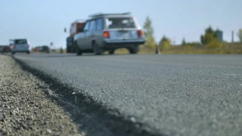 Shallow depth of field. Close-up of a freshly laid asphalt road. Road repair Stock-Footage 140212722
