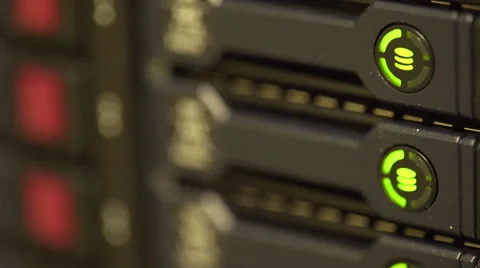 Shallow depth of field hard drive lights blinking on a server Stock Footage 60585325