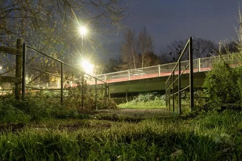 A shallow depth of field, low angle shot of street lights and traffic trails Stock Photos
