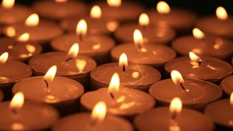 Shallow depth of field macro of burning red candles on the rotating stand Stock Footage 328108102