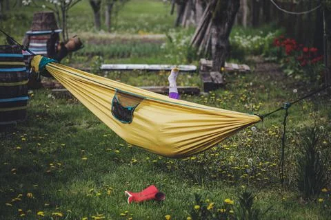Shallow depth of field (selective focus) details with a little girl in a hamm Stock Photos
