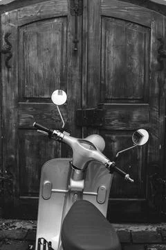 Shallow depth of field (selective focus) details with a scooter with a wooden Stock Photos