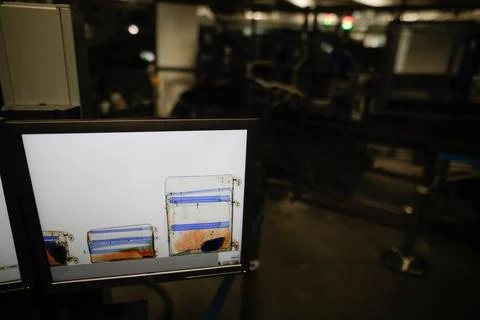 Shallow depth of field (selective focus) image with a screen showing luggag.. Stock Photos