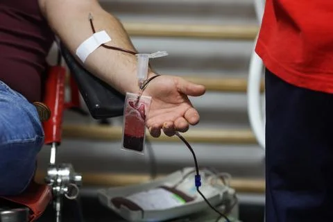 Shallow depth of field (selective focus) details with the hand of a man don.. Stock Photos