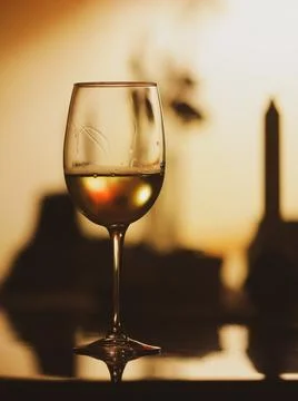Shallow depth of field (selective focus) details with a glass of white wine.. Stock Photos