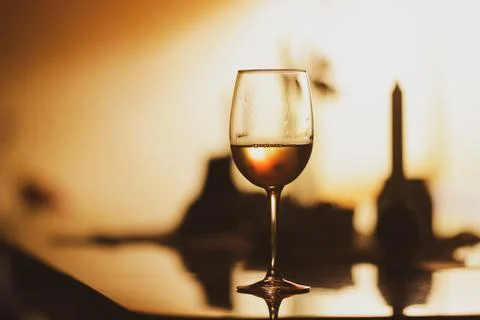 Shallow depth of field (selective focus) details with a glass of white wine.. Stock-Fotos