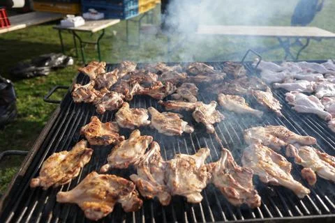 Shallow depth of field (selective focus) details with chicken thighs on a m.. Stock Photos