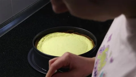 Shallow depth of field shot of cheesecake with baker background Stock Footage 340610518
