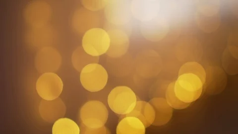 Shallow depth of field view and slow motion shot of orange bokeh lights Video stock 119021022