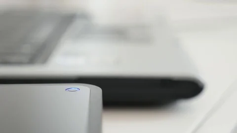 Shallow DOF data saving from laptop computer to USB external hard disc Video stock 74552125
