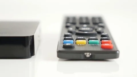Shallow DOF IR controller and black set-top-box with Video stock 75734833