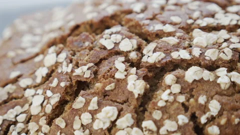 Shallow DOF upper surface of organic oat bread 4K video Stock Footage 144227808