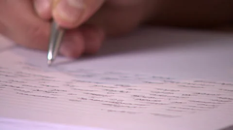 Shallow Focus Shot of Someone Writing in a Notebook Stock-Footage 48685599