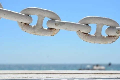 Shallow focus shot of white rusty interlinked chains Stock Photos