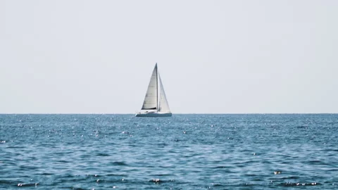 Shallow focus static shot,  sailboat sailing on the horizont. Stock Footage 132302881