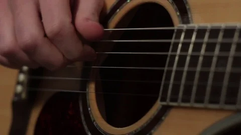 Shallow focus of the technique of the play on acoustic guitar Stock-Footage 70718340