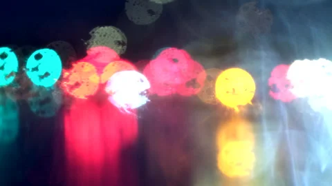 Shallow focus view while driving at night shows car rear lights Stock Footage 312928513