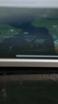 Shallow focus world map dashboard combines dotted location markers Stock Photos