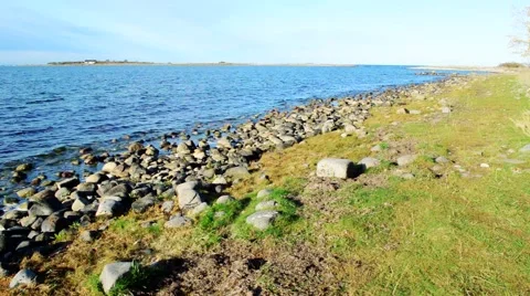 Shallow limestone shore with grass Stock Footage 56724351