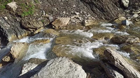Shallow mountain river with stone rapids. Peaceful view Stock Footage 300727476