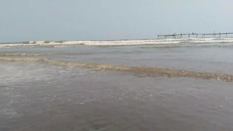 Shallow Ocean Waves Rolling on Sandy Beach Shoreline 4K Stock Footage 346532288