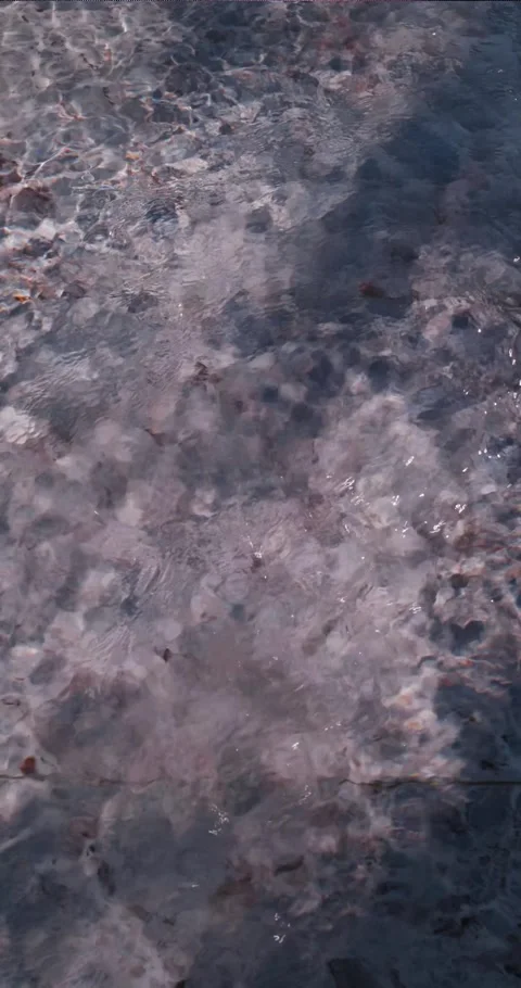 Shallow Pool with Patterned Tiles and Flowing Water – 4K Vertical Video Stock Footage 320518510