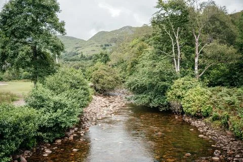 Shallow Stream Flowing Through Scottish Highlands Stock Photos
