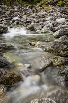 A shallow stream in the wild Stock-Fotos