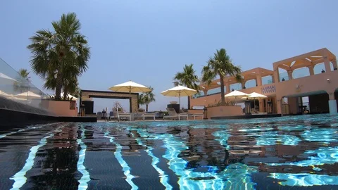 Shallow view from clear swimming pool in hotel in Dubai United Arab Stock Footage 111967835