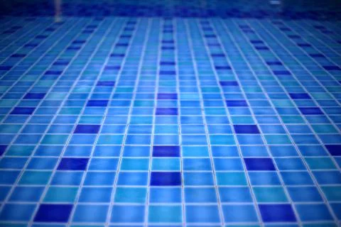 Shallow wadding pool water in swimming pool. pool design with small ceramic t Stock Photos