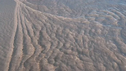Shallow water roll on sand Stock Footage 158369907