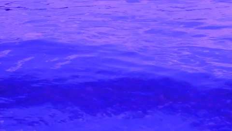 Shallow Water surface texture loop , sun shine natural clear violet water, slow Stock Footage 257865645