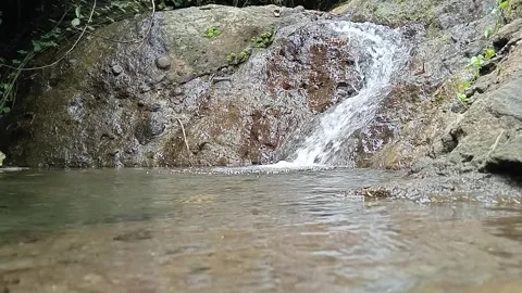 Shallow Waterfall and Rocky Stream in Natural Outdoor Setting Stock Footage 329782717