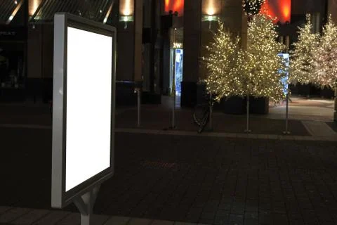 Shallow white vertical lightbox mockup in urban and Christmas environment at  Foto stock