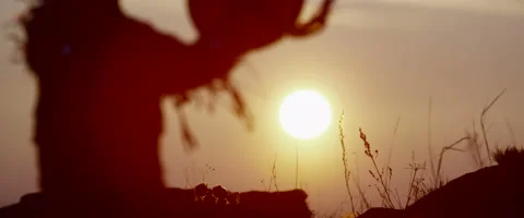 Shaman casts a spell on the sun 3 Stock Footage 50581905