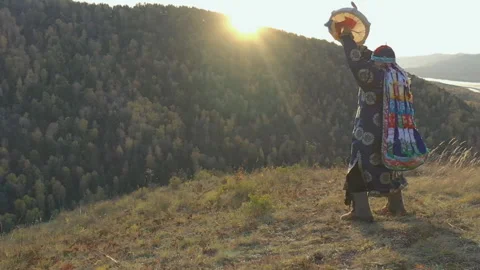 The shaman communicates with the spirits of the forest with dance with a Stock Footage 119439437