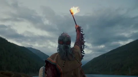 Shaman on the lake background Stock Footage