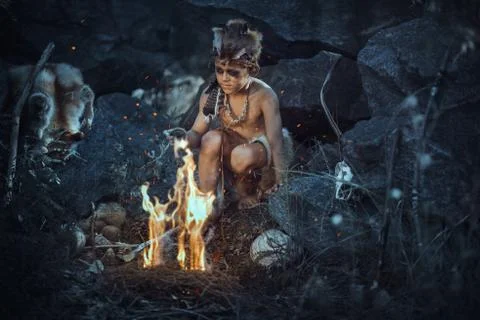 Shamans boy at the fire Stock Photos