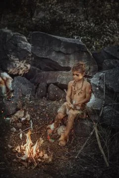 Shamans boy at the fire Stock Photos