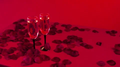 Сhampagne on the festive table with a red decor. Stock Footage 85677577